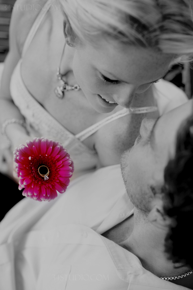 engagement ring on a purple flower 