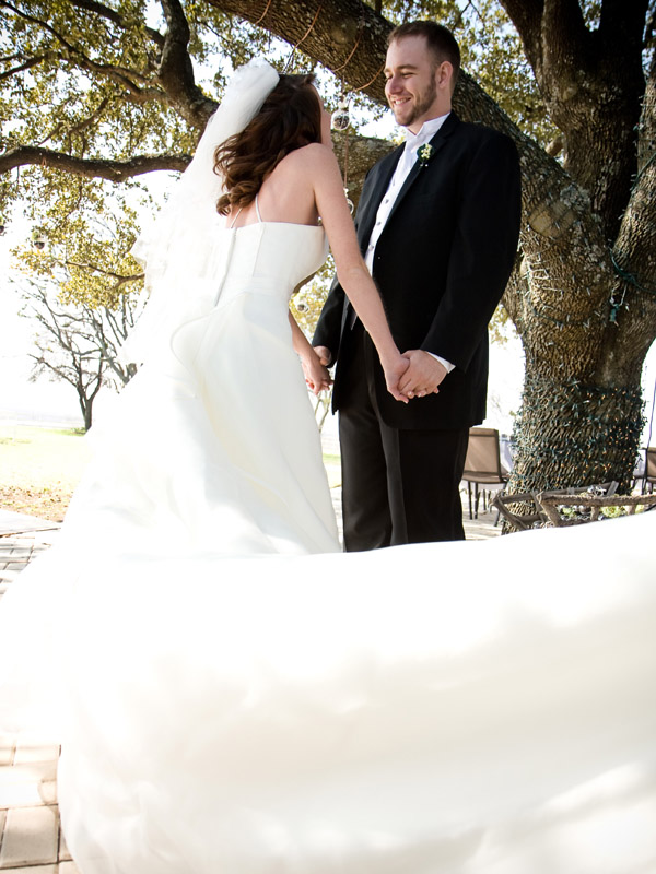 bride and groom holding hand in a ranch