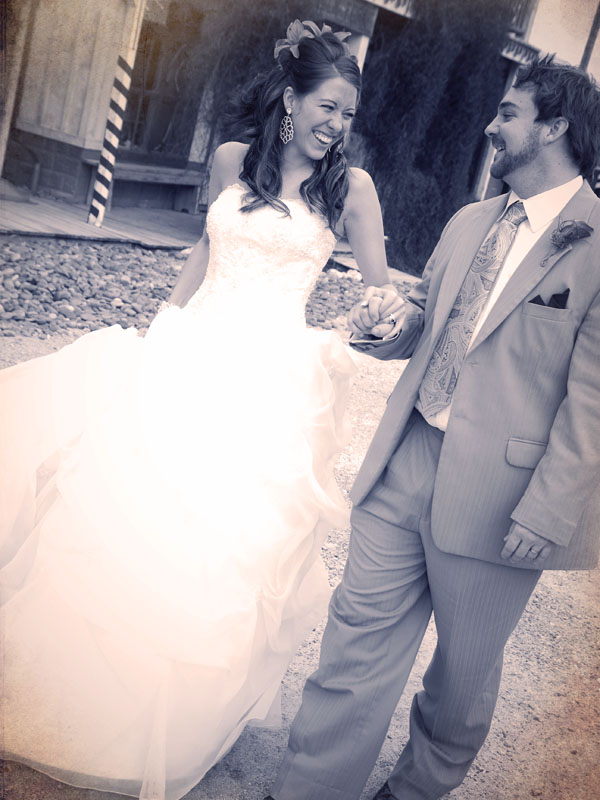 bride and groom looking at each other sepia portrait in Frisco Texas