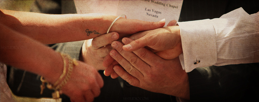 close up shot of groom holding brides hand and wedding vows