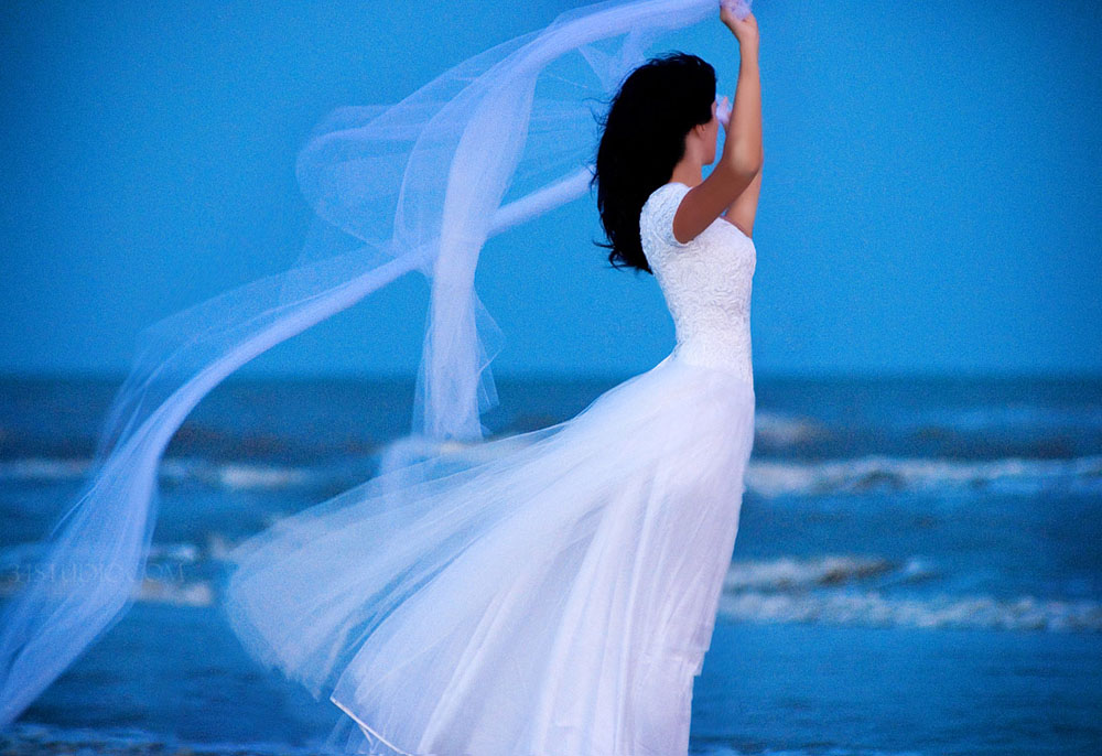 flying veil in galveston texas on the beach blue 