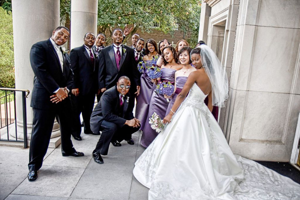 funky wedding party posing by SMU chapel in Dallas