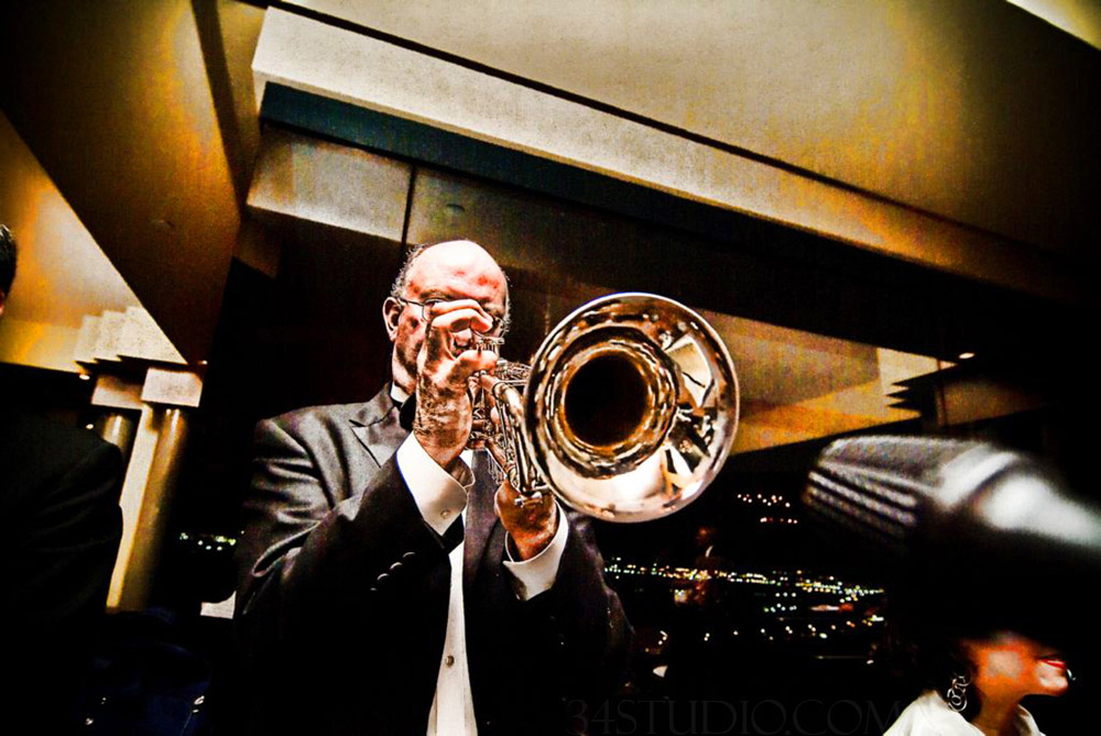 musician playing saxophone during the wedding